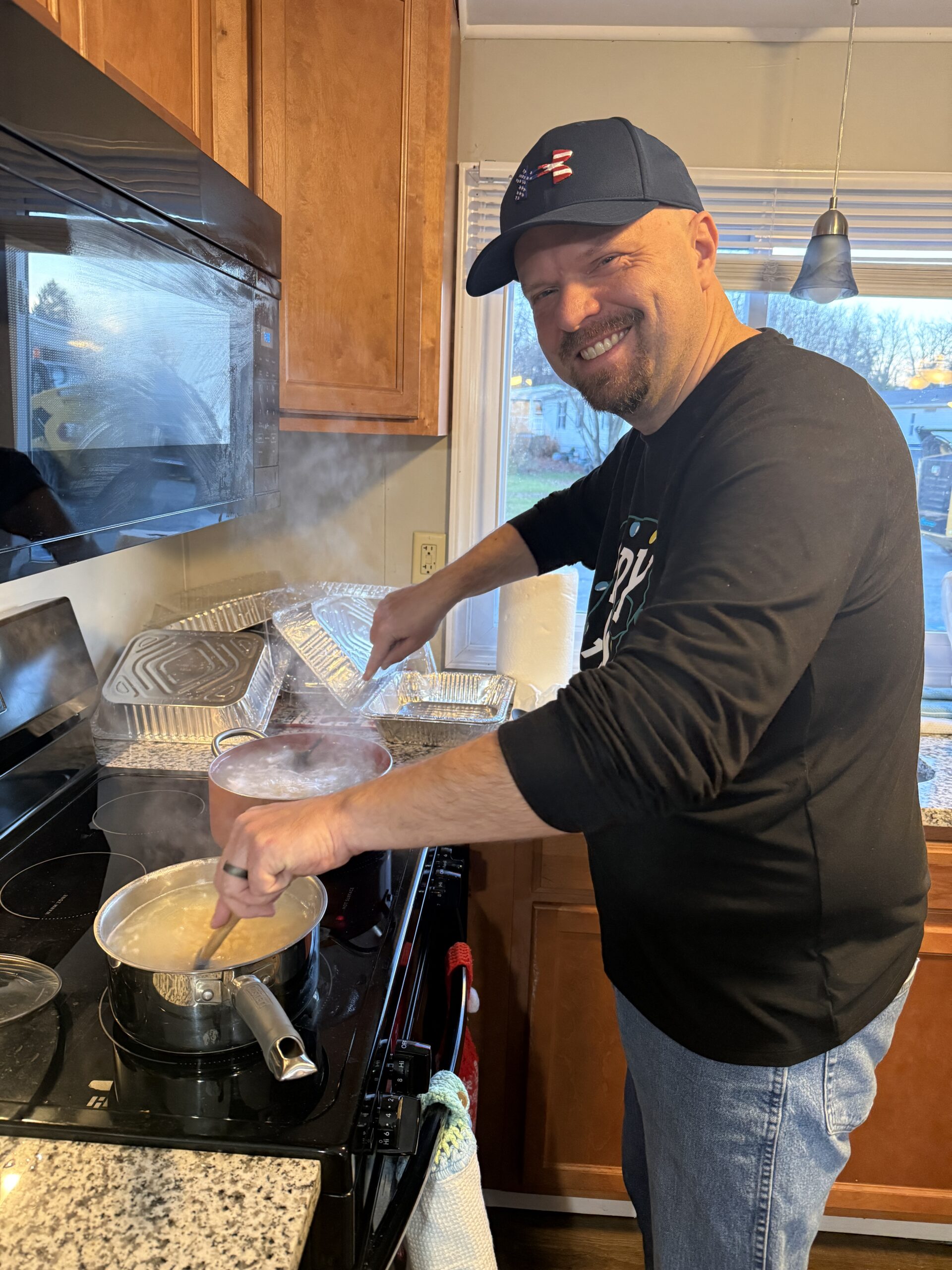 John cooking in the kitchen