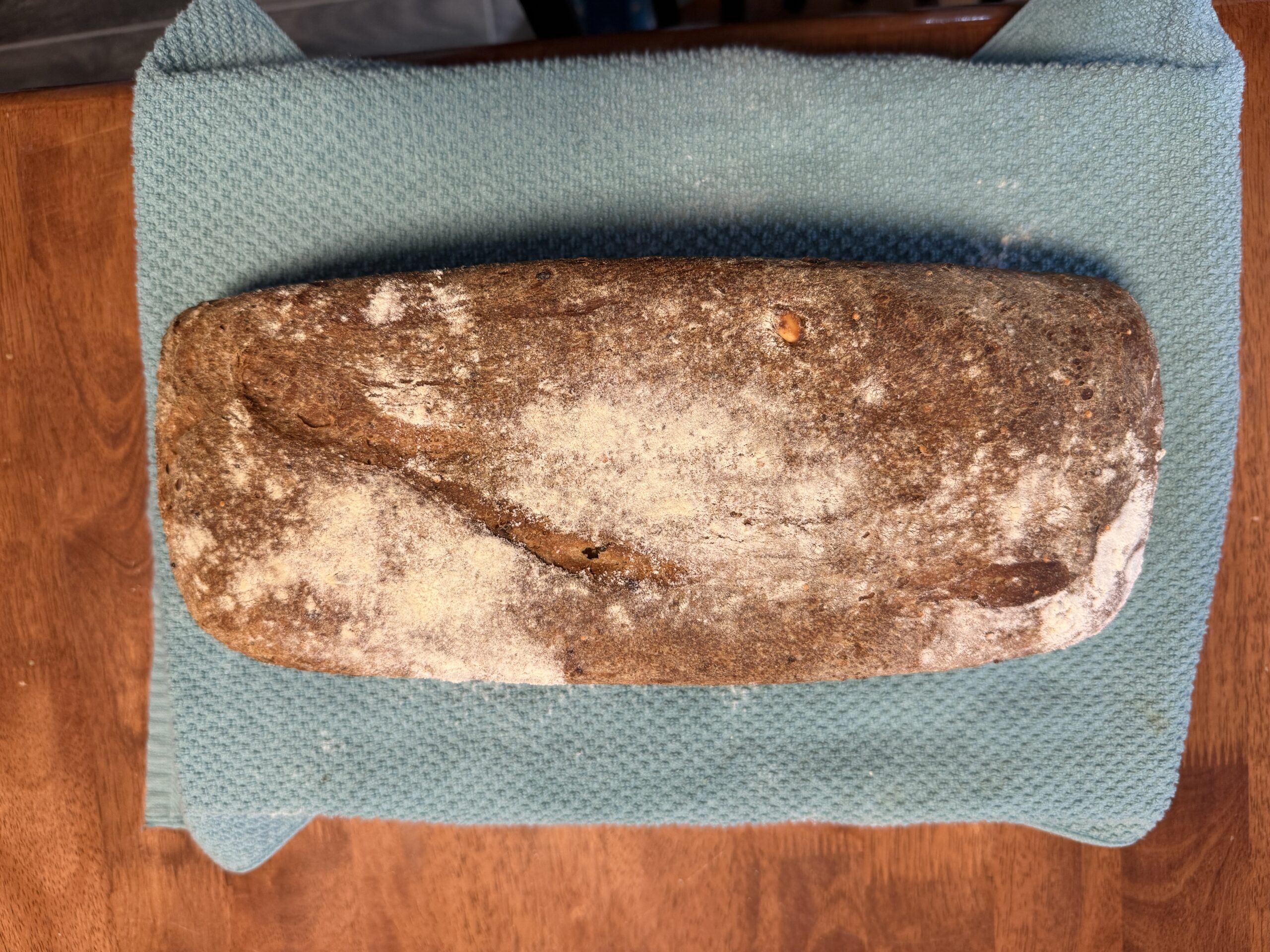 Seeded sourdough sandwich loaf baked in a 5x13 bread pan
